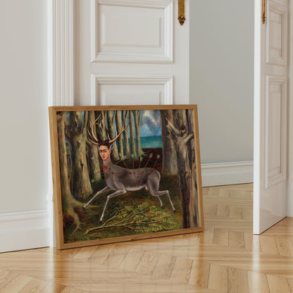 a framed painting of a deer with antlers in a forest setting.