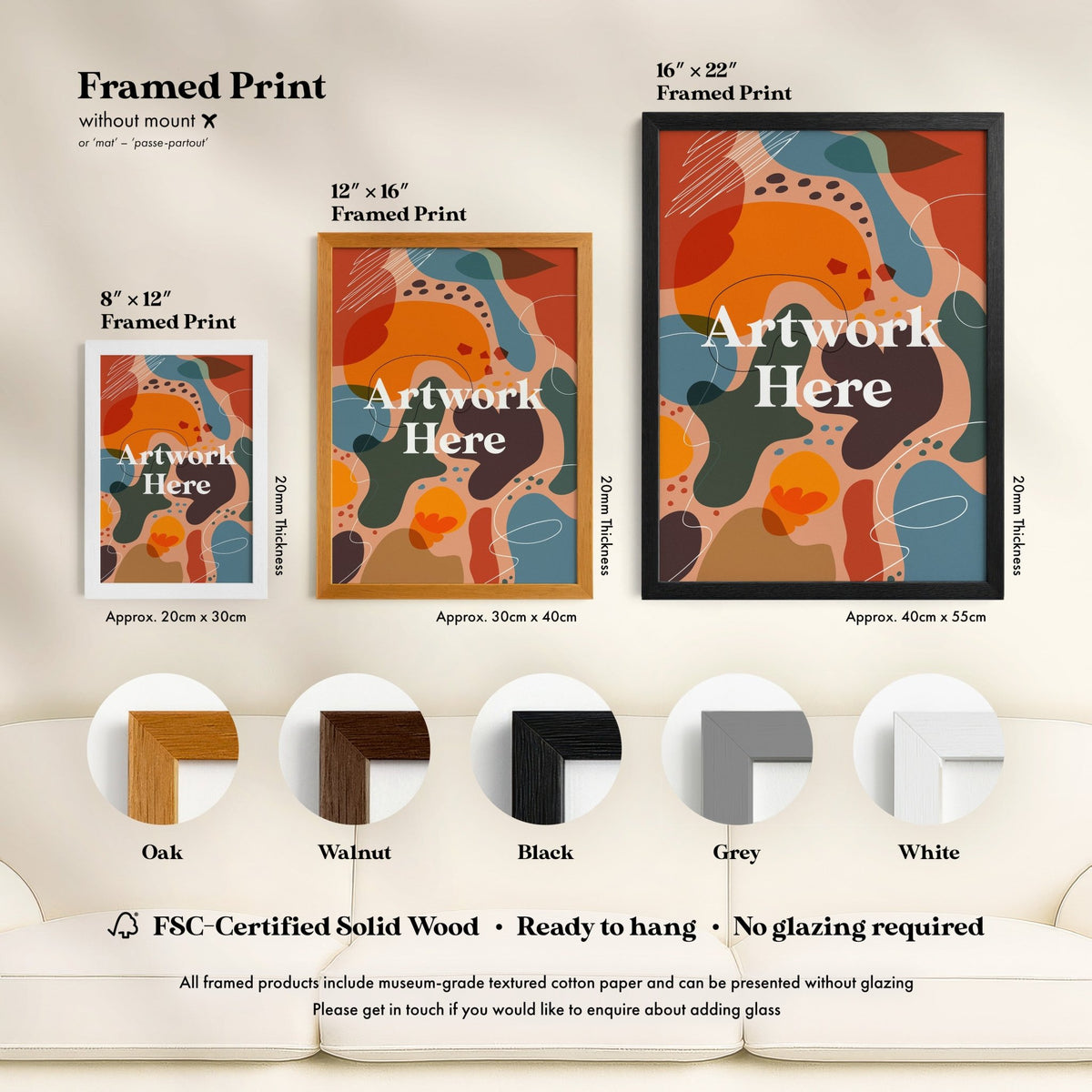 a living room with a white couch and a poster on the wall