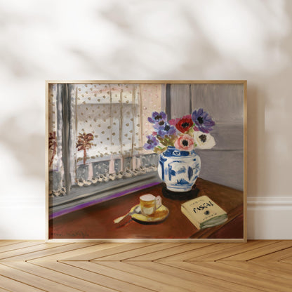 The image is a framed painting depicting a vase of colorful flowers on a table, with a book and a cup of tea nearby.