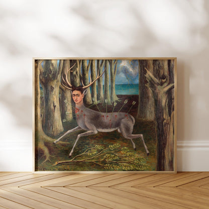 The image is a framed painting depicting a deer with antlers standing in a forest setting.