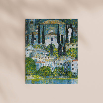 The image is a painting depicting a picturesque town with buildings, trees, and a body of water in the foreground.