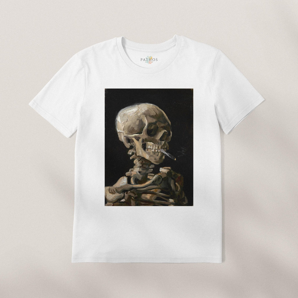 A white t-shirt with a framed image of a skeleton smoking a cigarette.